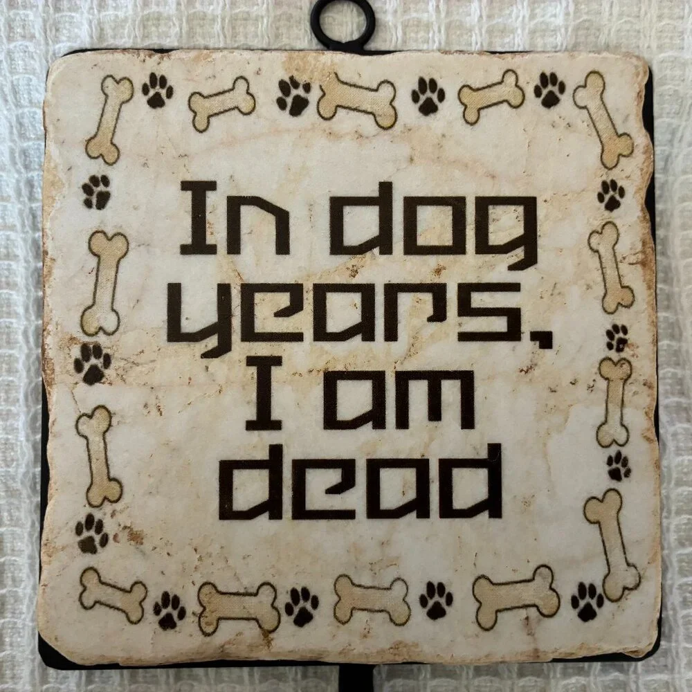 Two Italian marble dog-themed wall hooks
